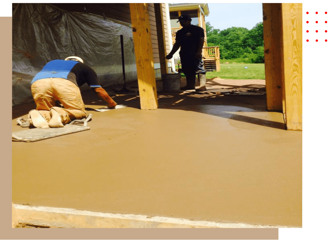 A group of people working on concrete.